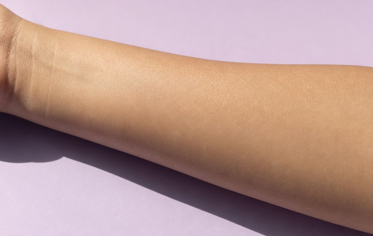 Macro photograph of calm, evenly toned skin