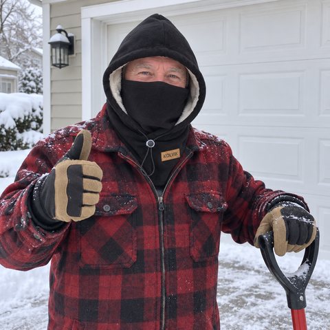 Paul D. in his snowy driveway wearing his black Kolvik hood